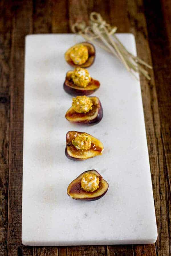 Easy Brûléed Fig, Pistachio and Honey Goat Cheese Bites recipe on @beardandbonnet www.thismessisours.com