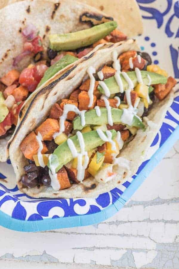 Roasted Sweet Potato and Black Bean Tacos recipe by @beardandbonnet. #bemorehere with @dixieproducts { www.thismessisours.com }