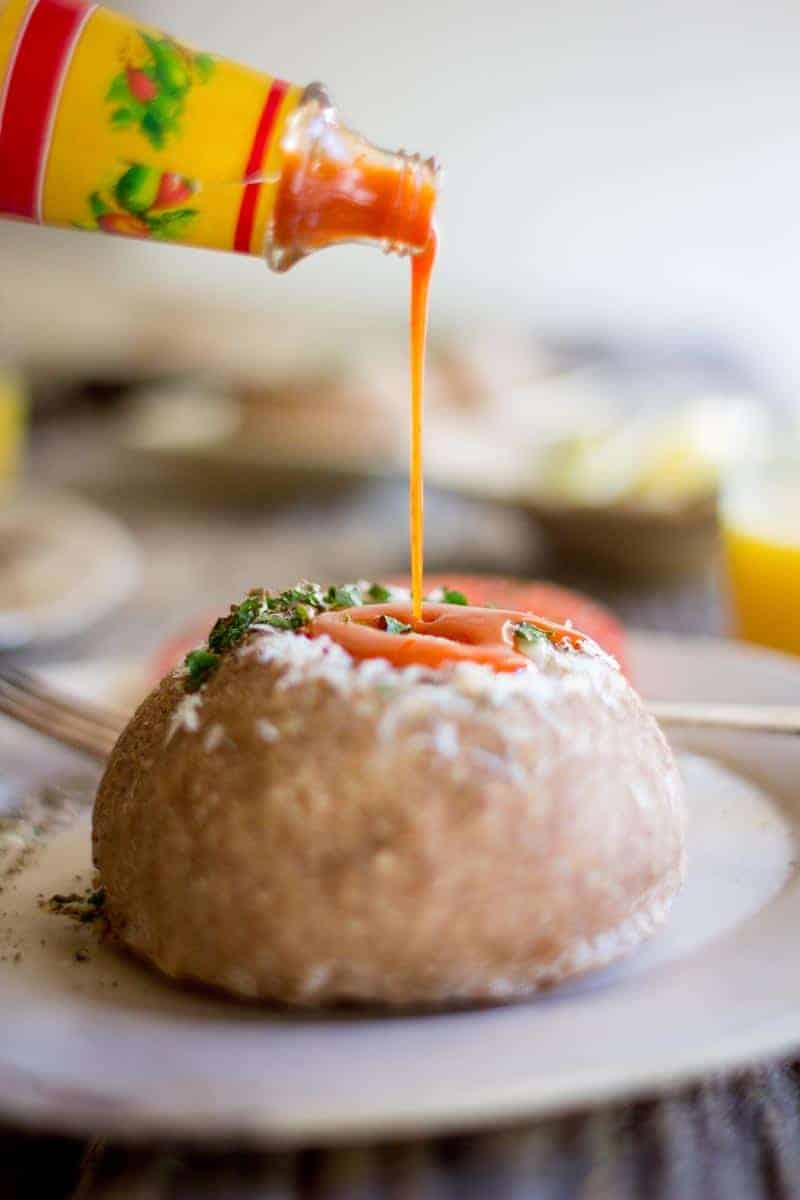 Perfect for brunch or an easy dinner! Hot sauce drizzled Sourdough Bread Bowl Egg in a Hole recipe by @beardandbonnet