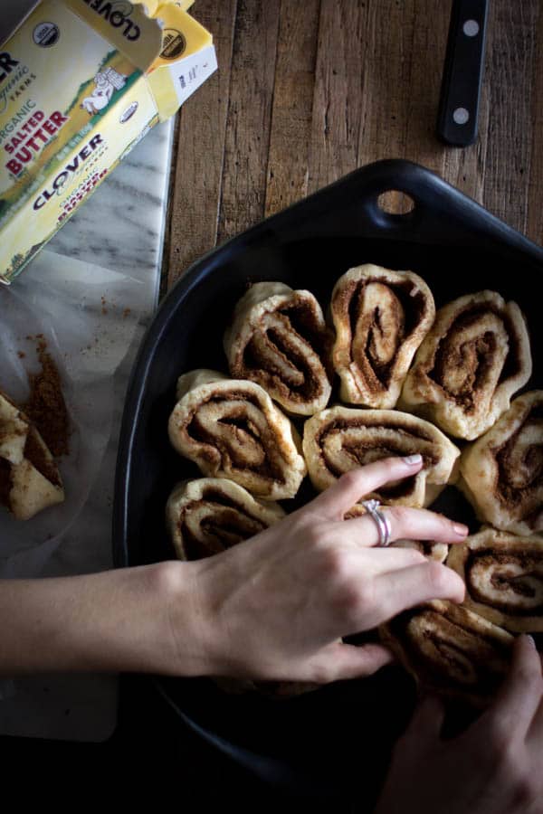 We're talking family traditions, both new & old while we serve up {Gluten Free} Cinnamon Rolls with @cloverstornetta | There is nothing better than being woken up by the smell of cinnamon rolls baking in the oven and most of the actual work that goes into creating this recipe can be done the night before, so no one has to wake up at the crack of dawn to have a delicious cinnamon laced breakfast! The whole process to make these luscious cinnamon rolls takes a few hours, which means we can listen to our favorite holiday records while we prep the dough and even watch our family's favorite Christmas movie while we wait for it to rise. | on @beardandbonnet