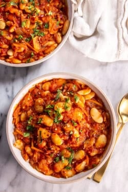 Two bowls of Mediterranean-Style Baked Lima Beans
