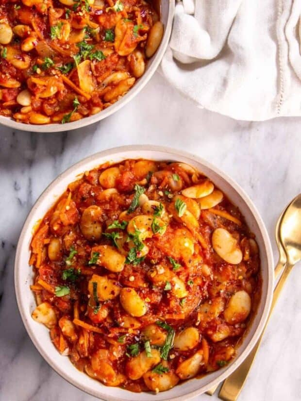 Two bowls of Mediterranean-Style Baked Lima Beans