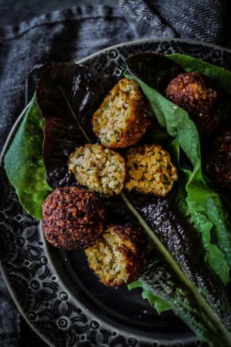 Sweet Potato & Millet Falafel split open over red and green leaf lettuce