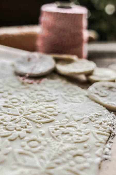 An up close image of a slab of salt dough with a pattern imprinted on it