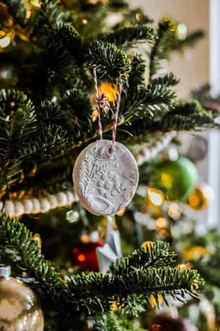 A salt dough ornament on a decorated tree