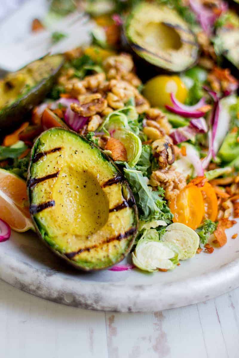 a grilled avocado on a salad