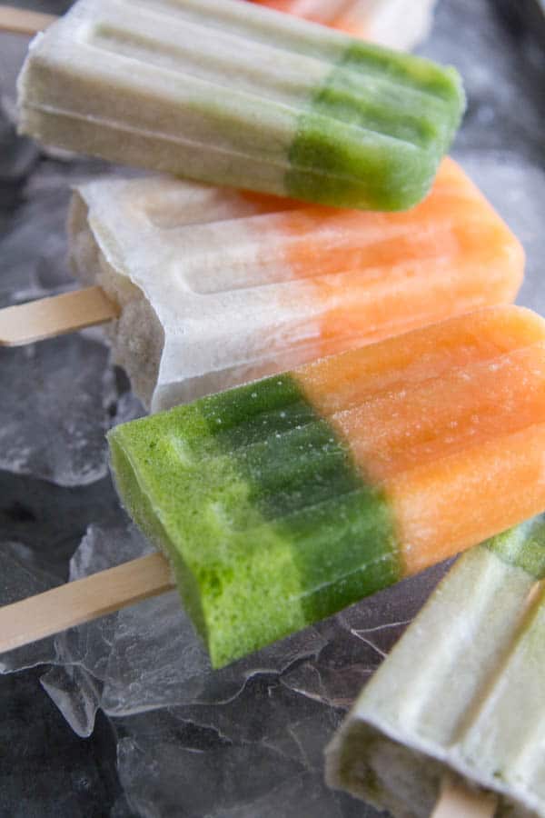 Easy Fresh Juice Pops with the @vitamix Ascent series A3300 blender. || Apple Basil Green Juice, Tropical Carrot Cooler, and an irresistable vanilla coconut cream layer! || @thismessisours