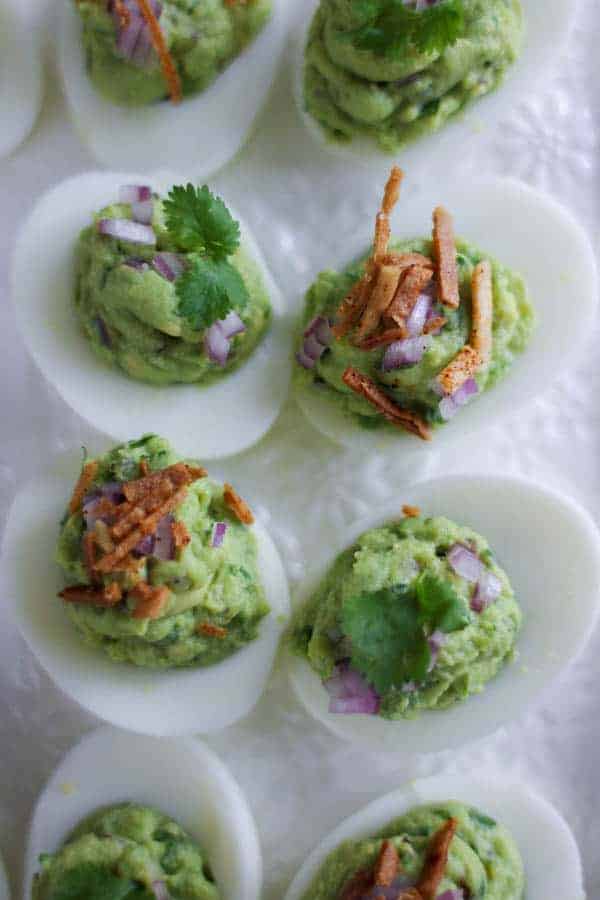 Chips and Guac Deviled Eggs recipe || This deviled eggs recipe is a total game changer! If you love to snack on guacamole and tortilla chips than this update to the classic deviled egg recipe is going to have you swooning! || @thismessisours #glutenfree