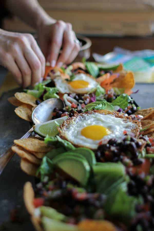 Huevos Rancheros Breakfast Salad recipe || The runny yolks of these crispy frizzled eggs mix perfectly with the spicy tart juices from homemade pico creating one heck of a dressing for this Easter brunch worthy breakfast salad! || @thismessisours @yourtaylorfarms #vegetarian #glutenfree #Easter