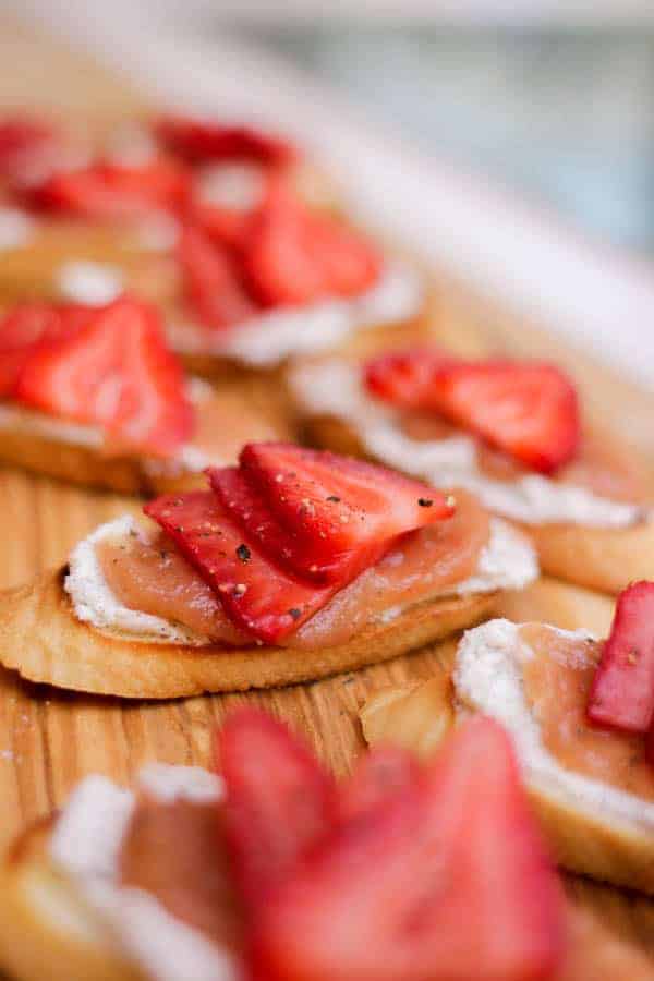 Rhubarb Jam & Vanilla Scented Goat Cheese Crostini recipe || We strive to not waste any of the ingredients we bring into the house. Case in point, this rhubarb jam. This jam is actually the solids leftover from making a rhubarb citrus simple syrup. It's sweet, tart, and completely decadent! || @thismessisours @pompeian #ad #glutenfree #vegetarian