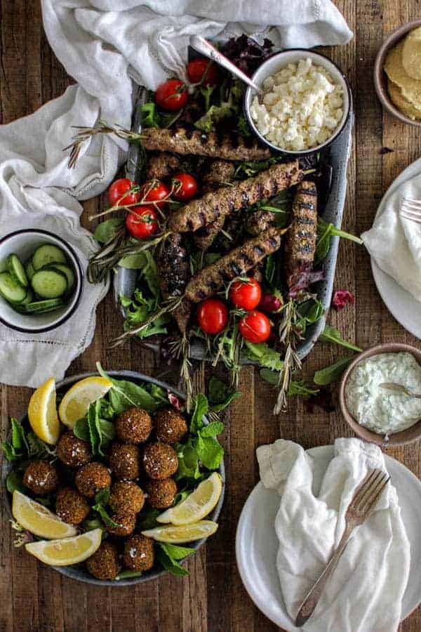 lamb kofta on rosemary skewers, falafel, tzatziki, cucumber slices, feta