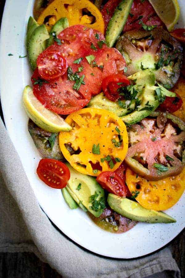 Simple Tomato and Avocado Salad recipe || Summers best tomatoes shine in this dish with just a hint of seasonings. || #VirtualMidsummerPotluck4Peace #vegan #glutenfree