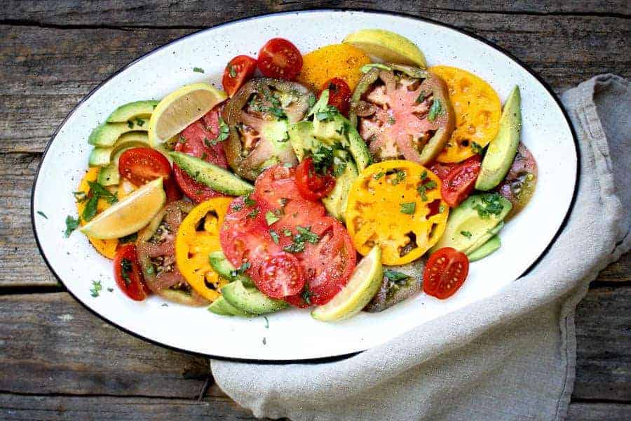 Simple Tomato and Avocado Salad recipe || Summers best tomatoes shine in this dish with just a hint of seasonings. || #VirtualMidsummerPotluck4Peace #vegan #glutenfree