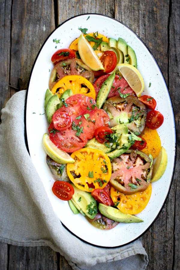 Simple Tomato and Avocado Salad recipe || Summers best tomatoes shine in this dish with just a hint of seasonings. || #VirtualMidsummerPotluck4Peace #vegan #glutenfree