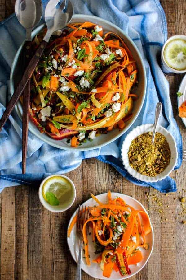 Carrot, Feta, and Pistachio Salad with Orange Blossom Toss recipe from @KaleandCaramel || Beautiful heirloom carrots thinly shaved & tossed with an incredible orange blossom scented dressing, herbs, pistachios, & feta. || @thismessisours #glutenfree #vegetarian