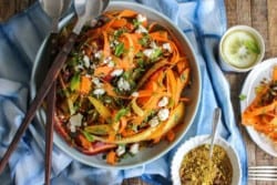 Carrot, Feta, and Pistachio Salad with Orange Blossom Toss recipe from @KaleandCaramel || Beautiful heirloom carrots thinly shaved & tossed with an incredible orange blossom scented dressing. || @thismessisours #glutenfree #vegetarian