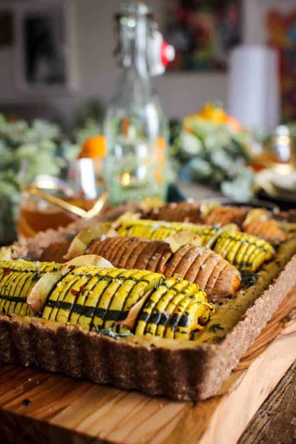 Vegan Hasselback Thanksgiving Tart recipe || this #vegan tart is sure to impress your friends and family this holiday season. Whether you serve it as a plant based main dish or a decadent side to your traditional turkey and mash, this one is sure to turn some heads! || @thismessisours #vegan #glutenfree #thanksgiving