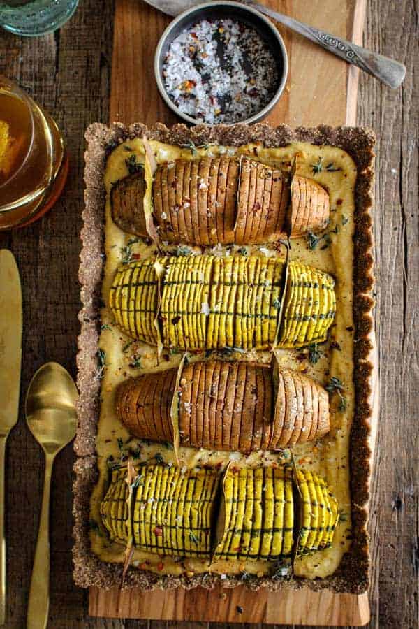 Vegan Hasselback Thanksgiving Tart recipe || this #vegan tart is sure to impress your friends and family this holiday season. Whether you serve it as a plant based main dish or a decadent side to your traditional turkey and mash, this one is sure to turn some heads! || @thismessisours #vegan #glutenfree #thanksgiving