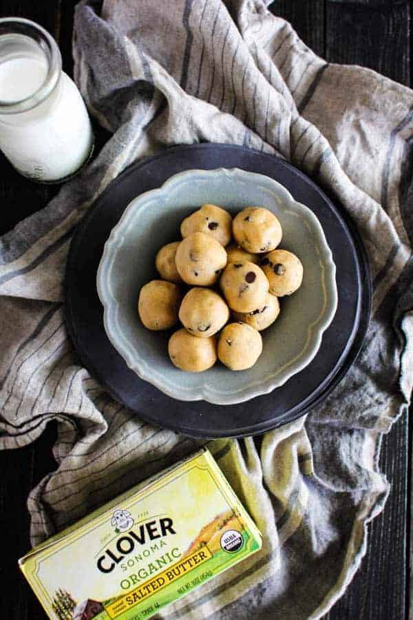 Peanut Butter Chocolate Chip Cookie Dough Bites recipe || Who doesn't love cookie dough?! Honestly, I think we like the dough more than the actual cookies which is why we created this egg free, no bake recipe that makes indulging in the best part of the cookie making process worry free! || @thismessisours #ad @cloversonoma #glutenfree #vegetarian #CheersToTraditions