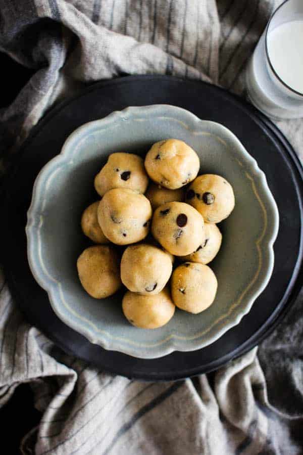 Peanut Butter Chocolate Chip Cookie Dough Bites recipe || Who doesn't love cookie dough?! Honestly, I think we like the dough more than the actual cookies which is why we created this egg free, no bake recipe that makes indulging in the best part of the cookie making process worry free! || @thismessisours #ad @cloversonoma #glutenfree #vegetarian #CheersToTraditions