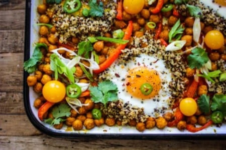 sheet pan with chickpeas, bell peppers, quinoa, eggs, cherry tomato, green onion