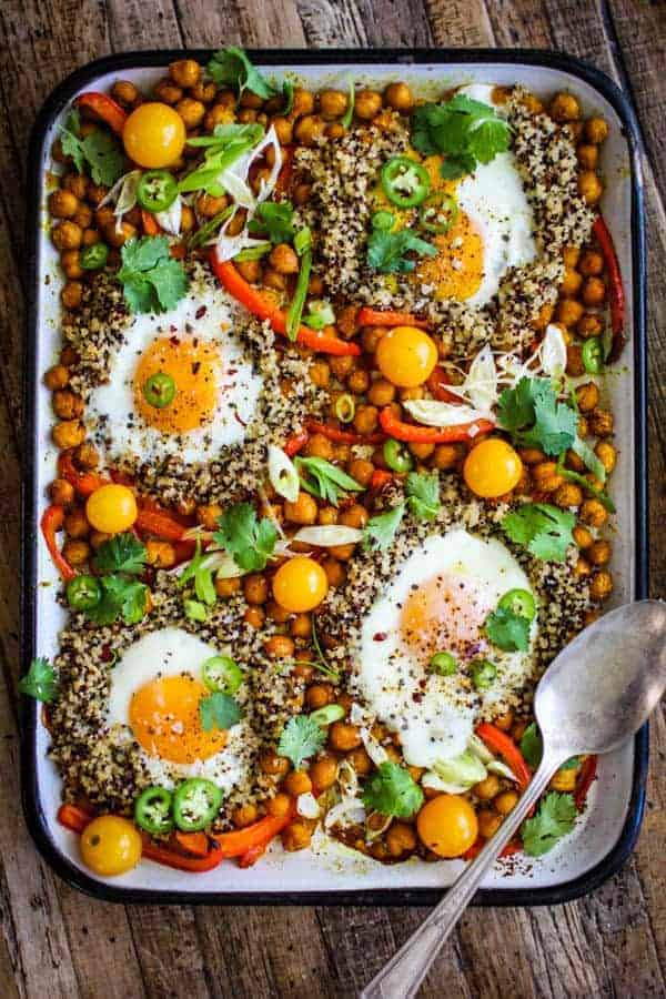 sheet pan with chickpeas, bell peppers, quinoa, eggs, cherry tomato, green onion