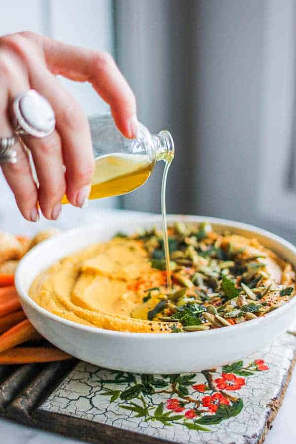 Roasted Butternut Hummus with Crispy Fried Sage recipe || Perfect for fall snacking or easy entertaining this hummus comes together with a handful of fall pantry staples and is sure to be a hit. || @thismessisours @friendswhofete #friendswhofete #vegan #glutenfree