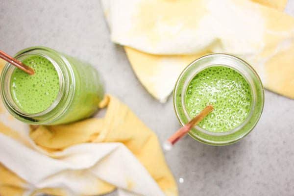 two large mason jars of a green smoothie