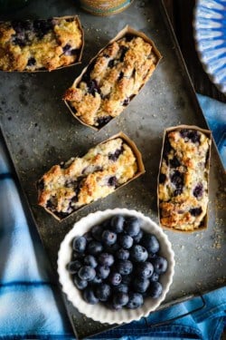 Mini gluten free blueberry honey quick breads and fresh blueberries