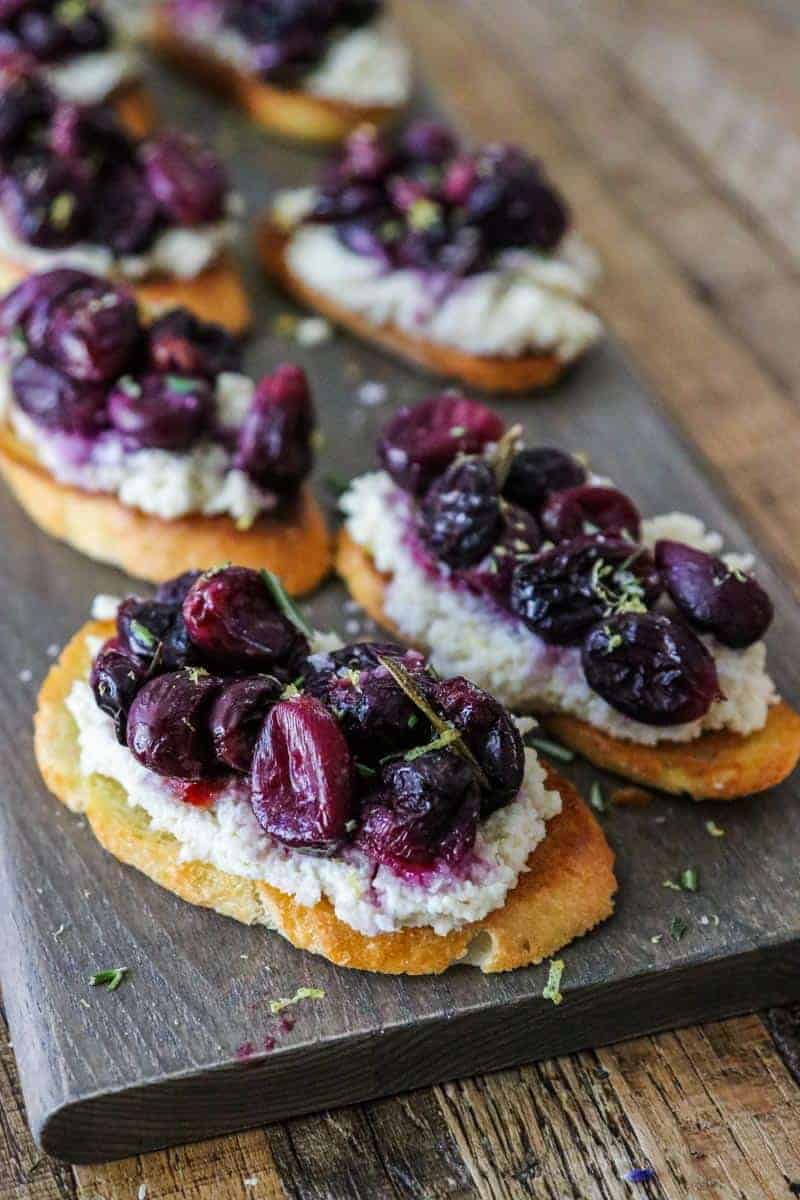 almond ricotta and topped with roasted rosemary grapes piled high on toasted baguette slices