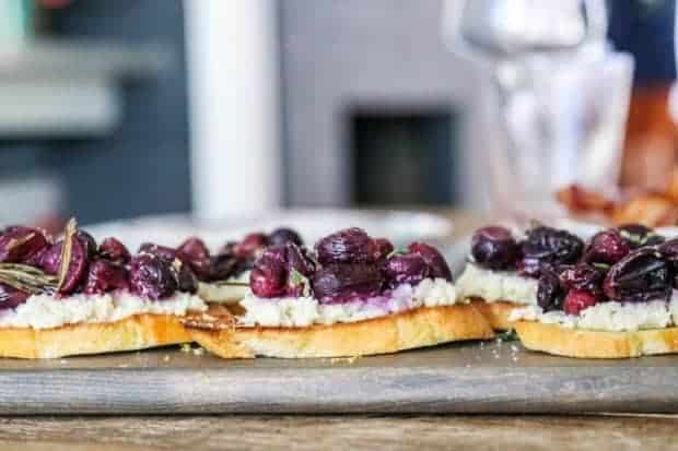 almond ricotta and topped with roasted rosemary grapes piled high on toasted baguette slices