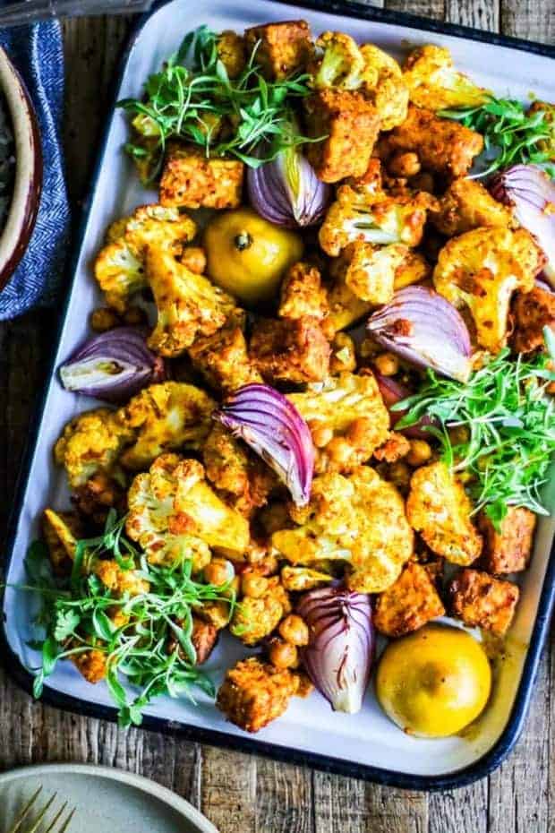 marinated chunks of tempeh, pan roasted with cauliflower, chickpeas, onion wedges, and lemons