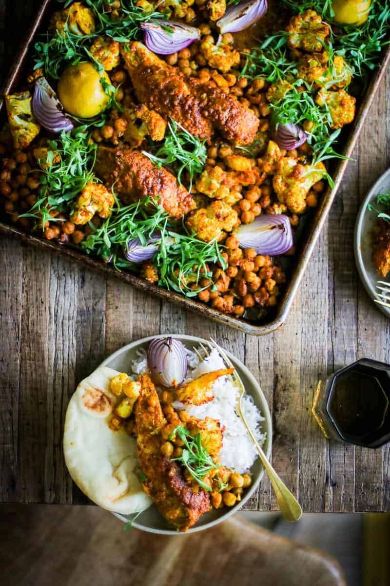 Shawarma Spiced Chicken Sheet Pan Dinner with chicken, cauliflower, chickpeas, red onion, lemon and cilantro