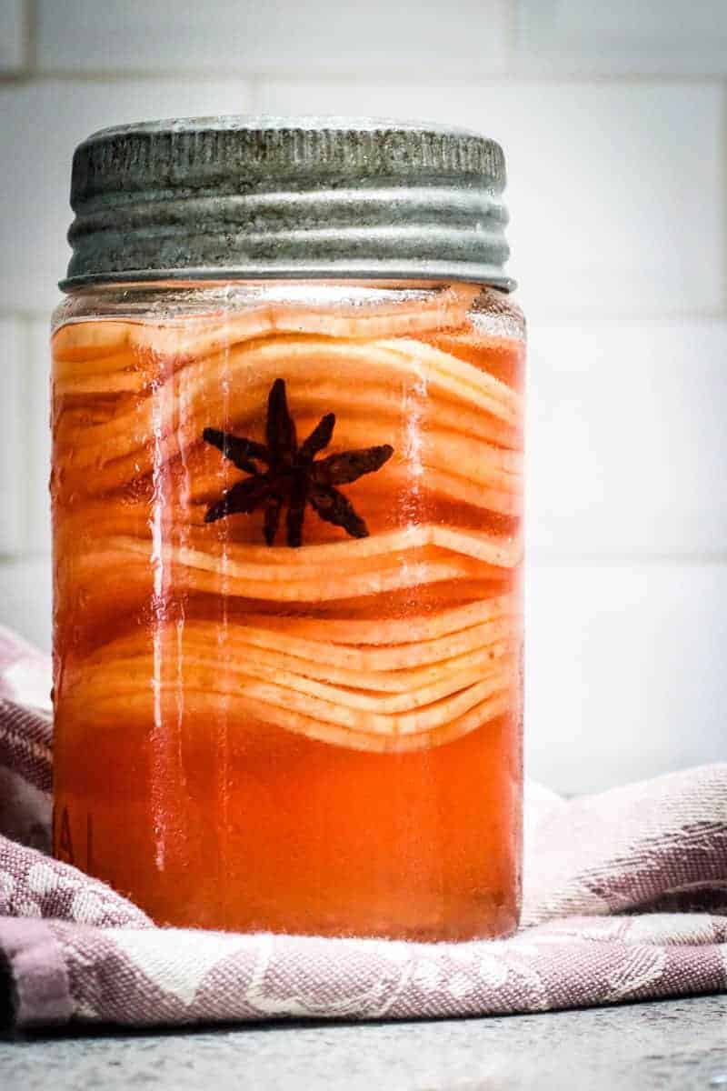pickled apples and star anise in jar