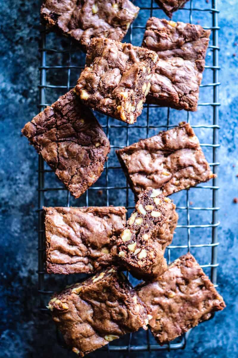 Brownie squares with walnuts on a cooling rack