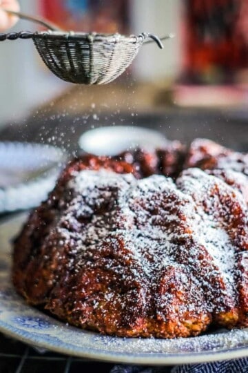 Apple chai monkey bread being dusted with powdered sugar