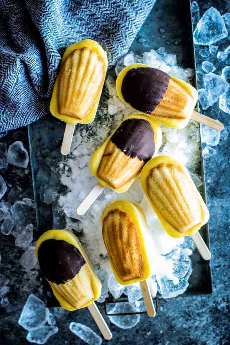 frozen vanilla pudding pops topped with madeleine cookies on top