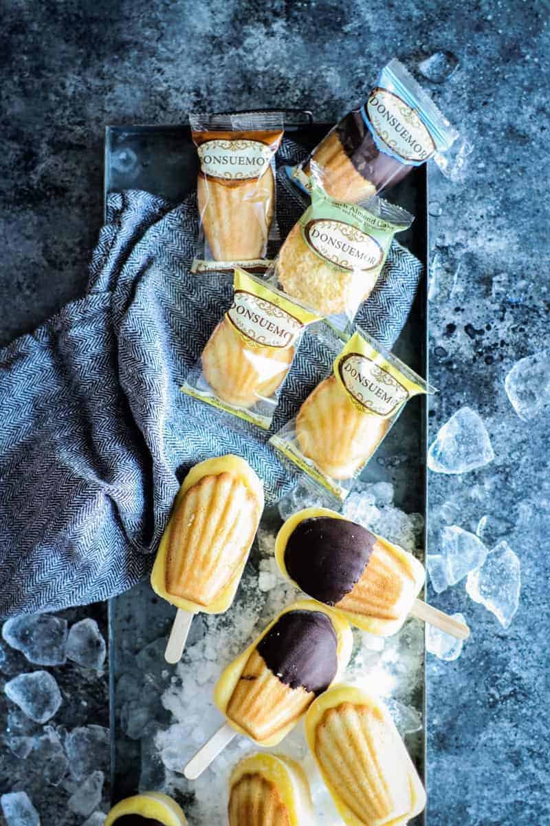 frozen vanilla pudding pops topped with madeleine cookies on top