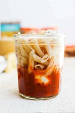 A close up of a prepared gluten free pasta snack jar