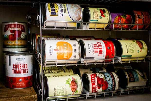 A variety of canned goods in a pantry.