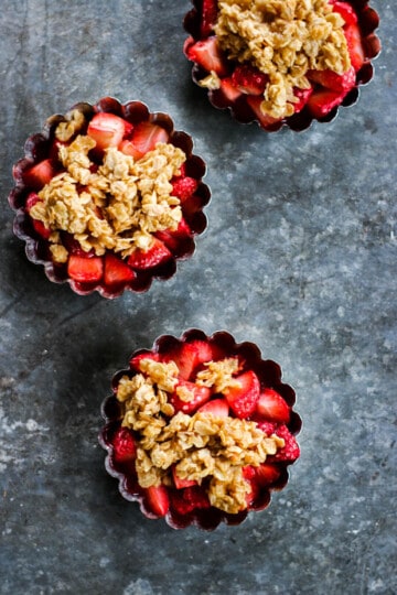 3 individual strawberry crisp pans are on a table