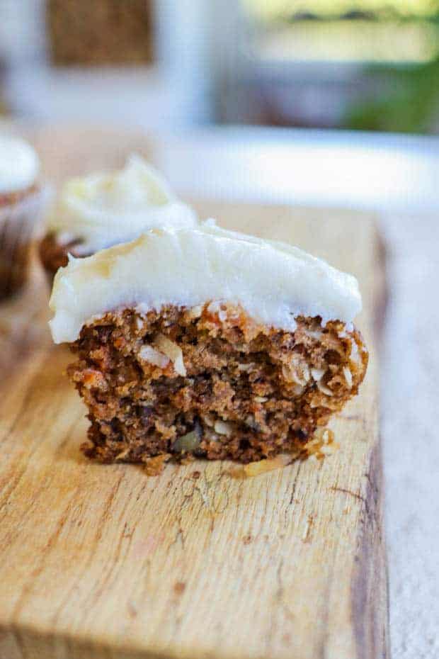 A Gluten Free Carrot Cake Muffin sliced in half showing the texture inside