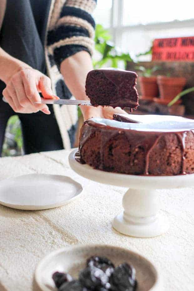 A slice of Chocolate Covered Prune Fudge Cake being plated