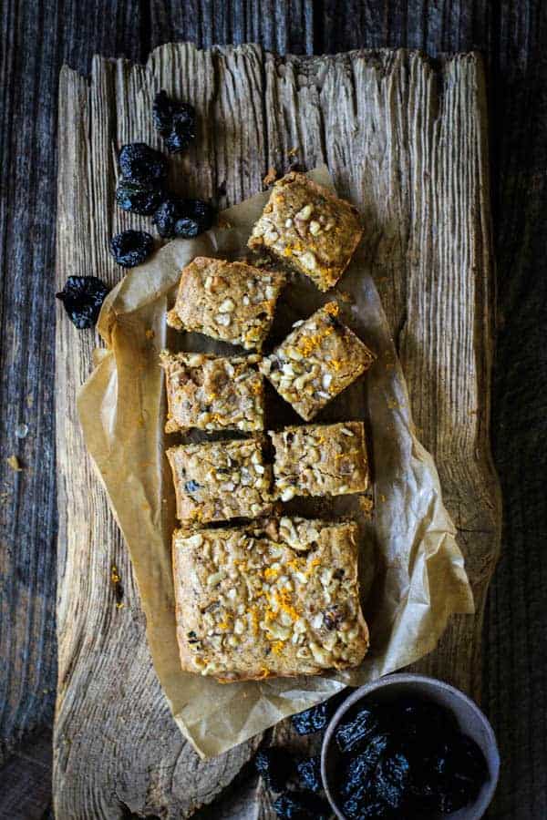 Coffee cake recipe partially sliced on a piece of brown parchment paper