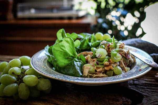 A plate of Easy Rotisserie Chicken Salad with lettuce underneath.