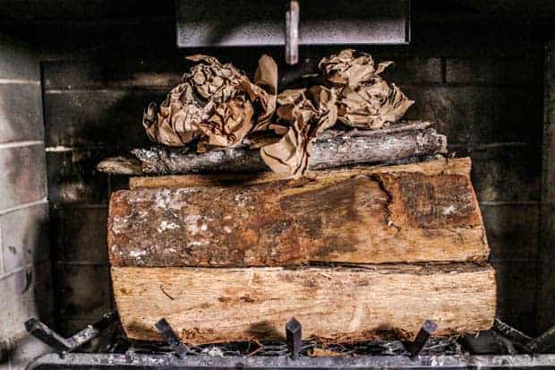 Wood, paper, and kindling stacked for An upside down fire.