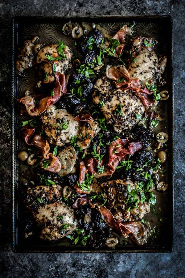 A sheet pan of Quick and Easy Sheet Pan Chicken Marbella