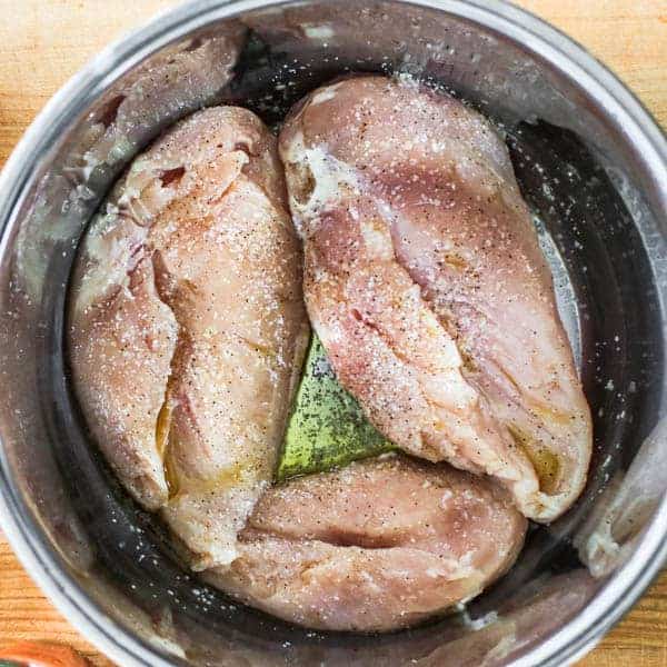 Boneless, skinless chicken breasts in an Instant Pot with salt, pepper , and olive oil