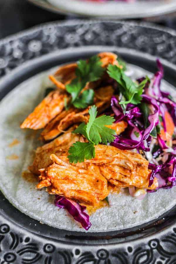 Shredded Instant Pot Mexican Chicken served in the form of a taco