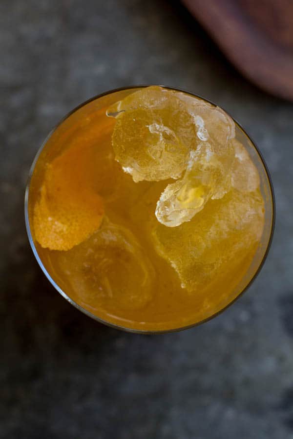 A top down image of the a pumpkin butter dark and stormy cocktail.